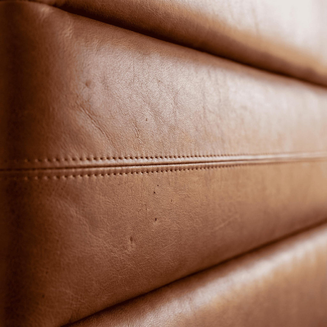 Moroccan Cow Leather Headboard | Thick Cowhide Bed Backrest, close-up detail view – Boho Sofa